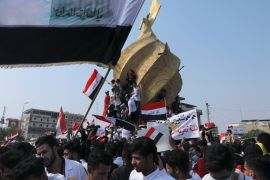 Universities students take part in a protest over corruption, lack of jobs, and poor services, in Kerbala