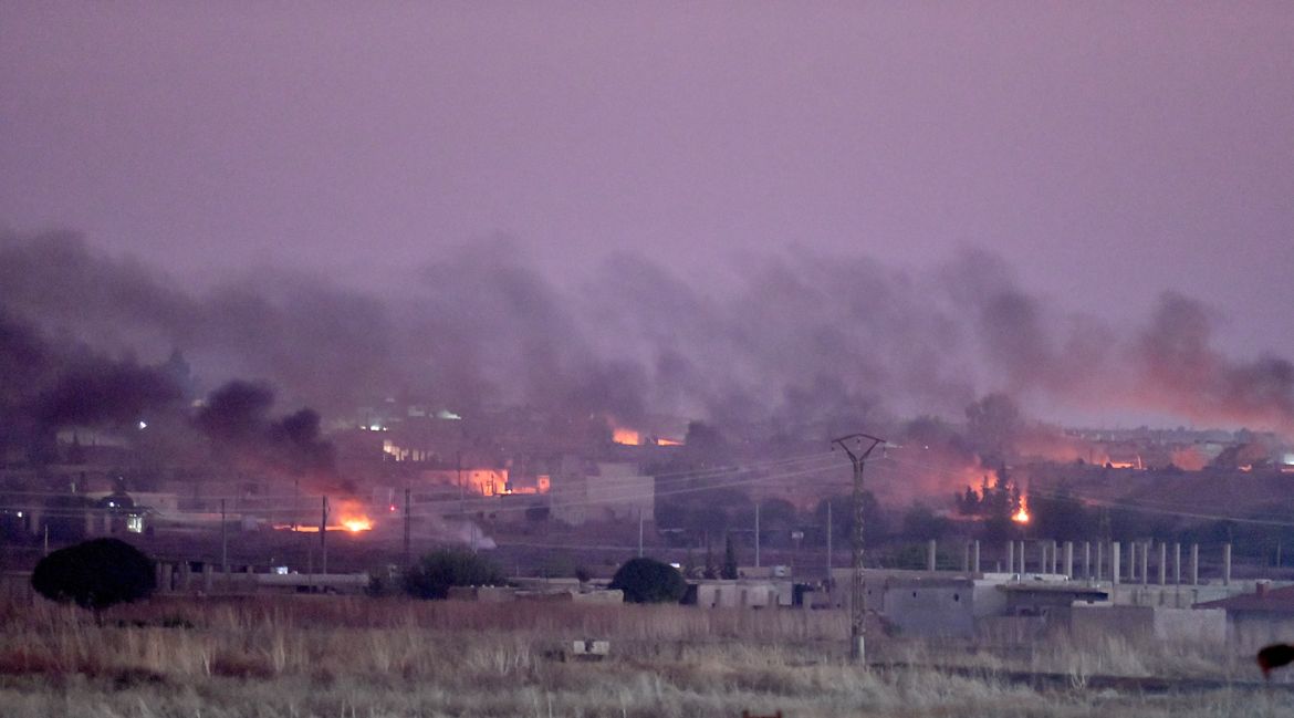 SANLIURFA, TURKEY - OCTOBER 09: A photo taken from Turkey''s Sanliurfa province, on October 09, 2019 shows smoke rises at the site of Ras al-Ayn city of Syria after terrorists burn tires to avoid being