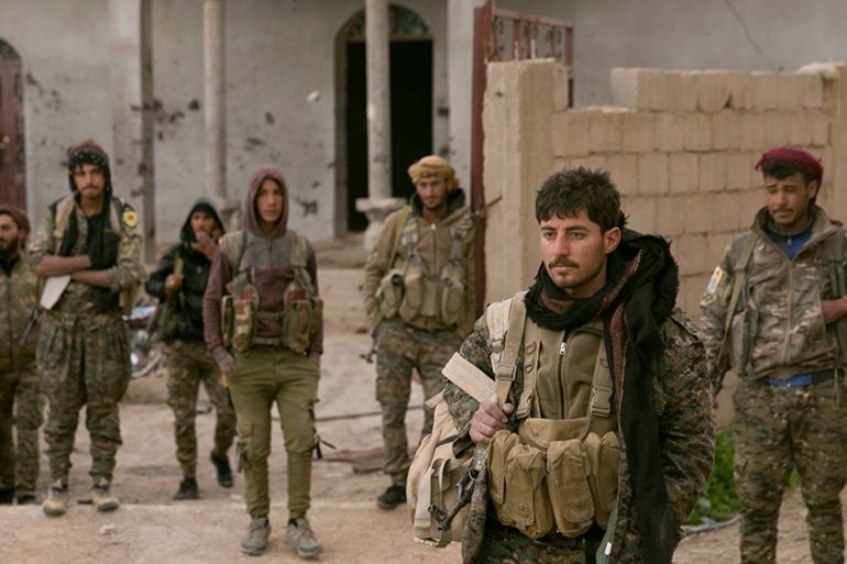 U.S.-backed Syrian Democratic Forces (SDF) fighters wait to go to the front line to oust Islamic State militants from Baghouz, Syria, Thursday, March 14, 2019. (AP Photo/Maya Alleruzzo)