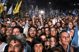 Supporters of Alberto Fernandez and his running mate and former President Cristina Fernandez de Kirchner, celebrate after Alberto Fernandez wins the general election, in Buenos Aires, Argentina Octobe