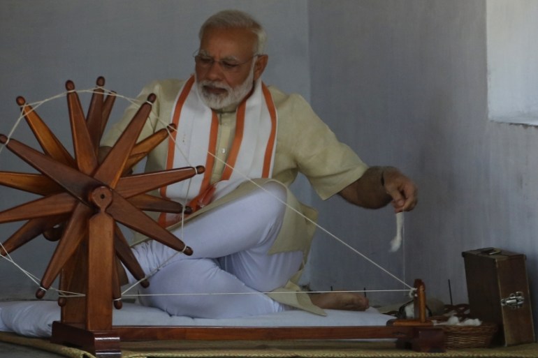 Indian prime minister Narendra Modi tries his hands on a spinning wheel during his visit to Gandhi Ashram, a residence of Mahatma Gandhi, in Ahmadabad, India, Thursday, June 29, 2017. Modi has condemn