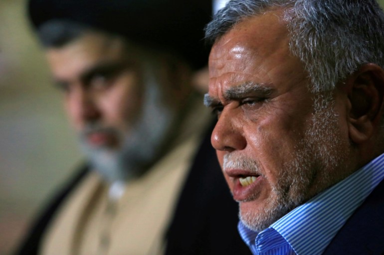 Leader of the Conquest Coalition and the Iran-backed Shi''ite militia Badr Organisation Hadi al-Amiri speaks during a news conference with Iraqi Shi''ite cleric Moqtada al-Sadr, in Najaf