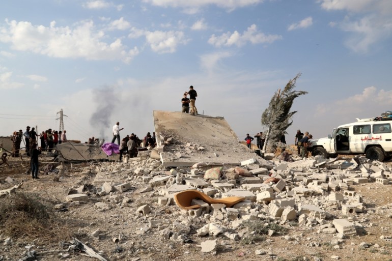 American volunteers (Free Ranger team) search the rubble of a house for the bodies of victims at Ras al-Ain town, northeastern Syria, 18 October 2019 (issued 19 October 2019). Turkey has launched an o
