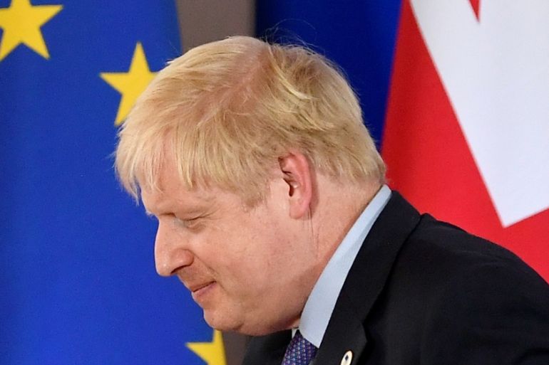 Boris Johnson leaves after attending a news conference at a European Union leaders summit dominated by Brexit, in Brussels, Belgium, in 2019
