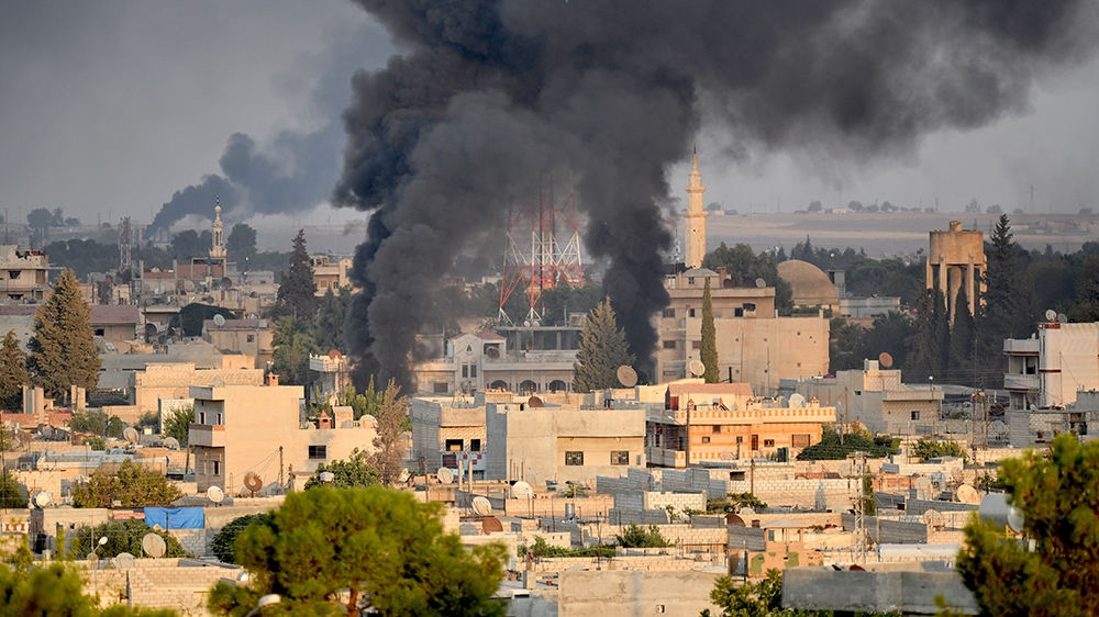 SANLIURFA, TURKEY - OCTOBER 09: A photo taken from Turkey's Sanliurfa province, on October 09, 2019 shows smoke rises at the site of Ras al-Ayn city of Syria as Turkish troops along with the Syrian Na