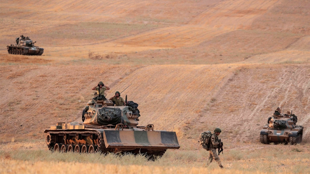 In this Monday, Oct.14, 2019 photo made available Tuesday, Oct. 15, 2019, Turkey''s forces advance towards Manbij, Syria. U.S. military spokesman says U.S. forces have left Kurdish-held town of Manbij