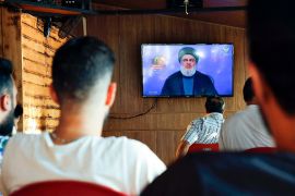 People listen to Hezbollah leader Sayyed Hassan Nasrallah on Hezbollah''s al-Manar TV channel, in a stronghold of the Lebanese Hezbollah group, in a southern suburb of Beirut, Lebanon, Sunday Aug. 25,