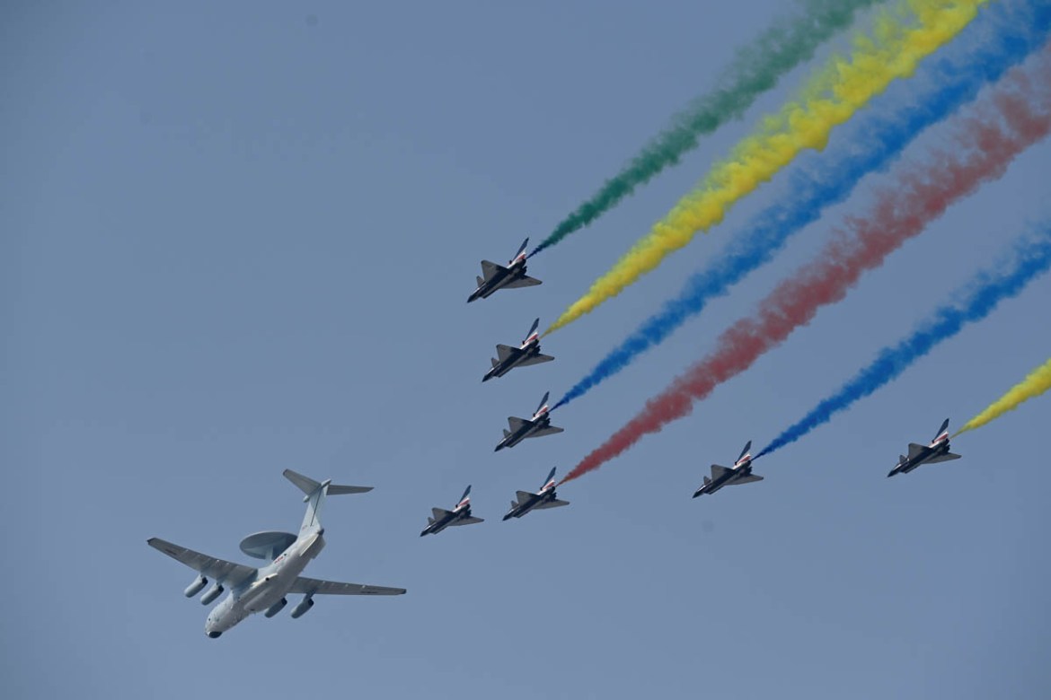 A formation of military airplanes, one KJ-2000 airborne early warning and control aircraft and eight J-10 multirole fighter jets, fly over Beijing during a military parade at Tiananmen Square on Octob