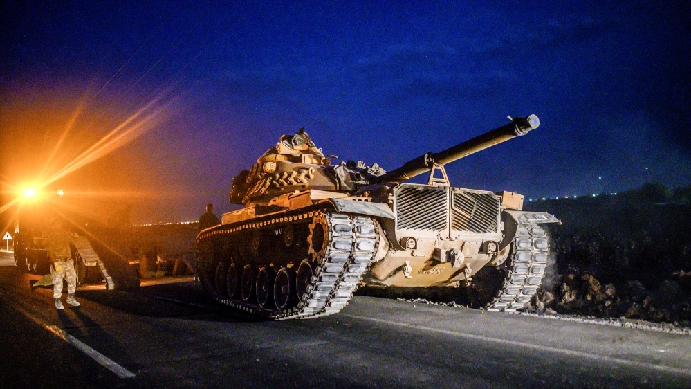 A Turkish army's tank drives towards the border with Syria near Akcakale in Sanliurfa province on October 8, 2019. Turkey said on October 8, 2019, it was ready for an offensive into northern Syria, w