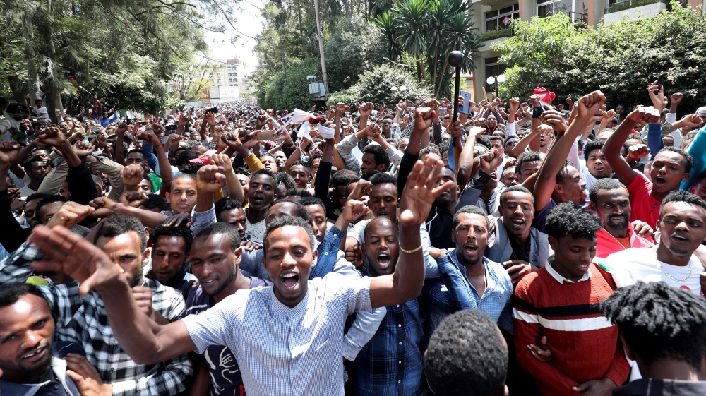 Oromo youth shout slogans outside Jawar Mohammed's house, an Oromo activist and leader of the Oromo protest in Addis Ababa