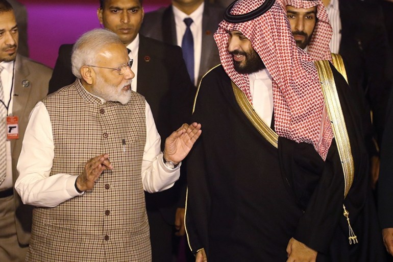 India''s Prime Minister Narendra Modi talks to Saudi Arabia''s Crown Prince Mohammed bin Salman upon his arrival at an airport in New Delhi, India, February 19, 2019