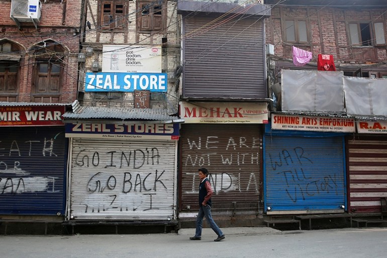 A Kashmiri man walks near closed market in Srinagar, the summer capital of Indian Kashmir, 30 October 2019. Five non-local laborers were killed and another injured by suspected militants in south Kas
