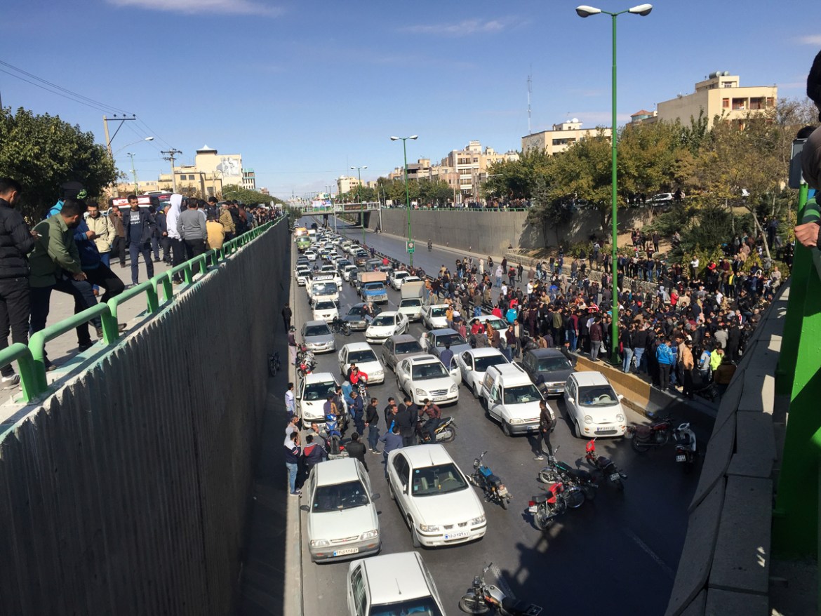 Cars block a street during a protest against a rise in gasoline prices, in the central city of Isfahan, Iran, Saturday, Nov. 16, 2019. Demonstrators angered by a 50% increase in government-set gasolin
