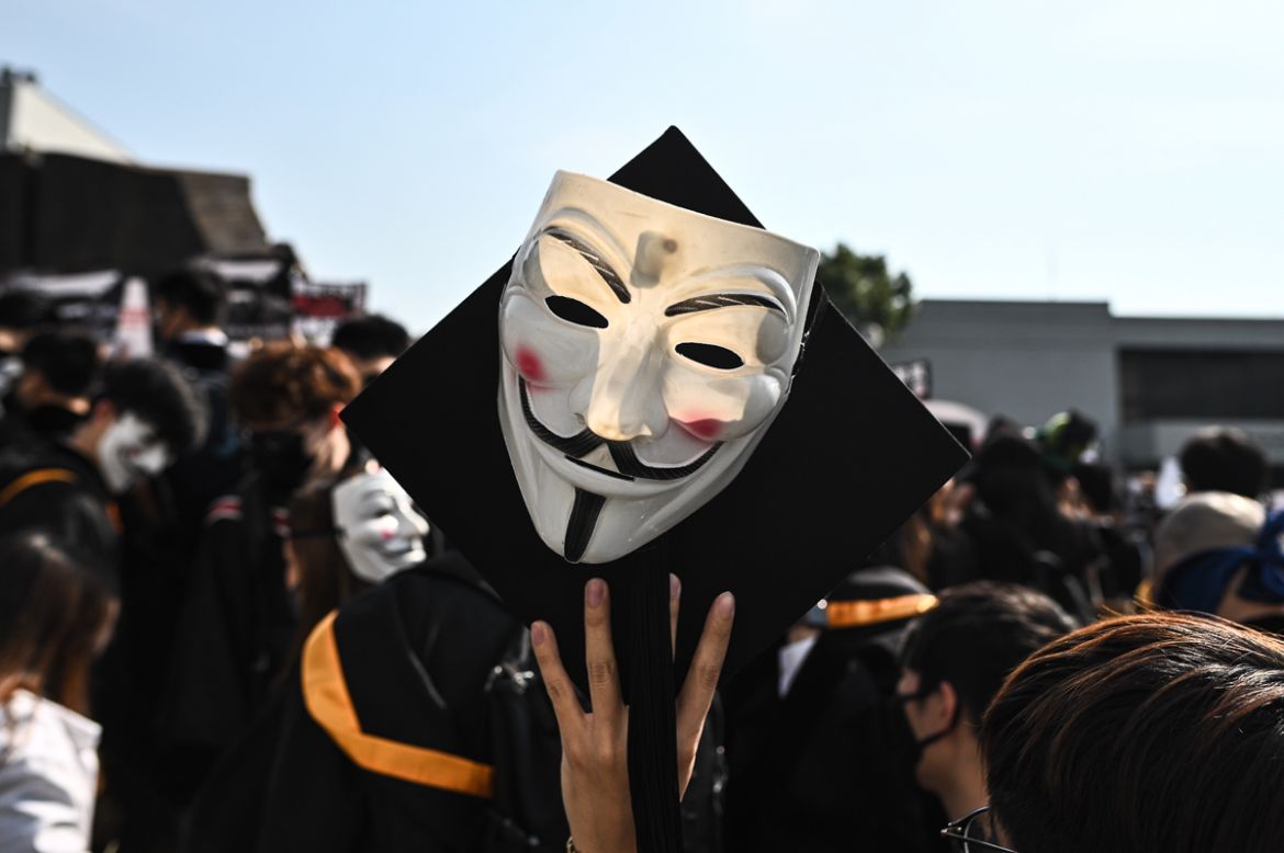 University students wear Guy Fawkes masks, popularised by the ''V For Vendetta'' comic book film, during an anti-government protest at their graduation ceremony at the Chinese University of Hong Kong on