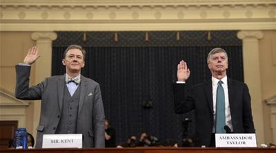 Career Foreign Service officer George Kent and top U.S. diplomat in Ukraine William Taylor, right, are sworn in to testify during the first public impeachment hearing of the House Intelligence Committ