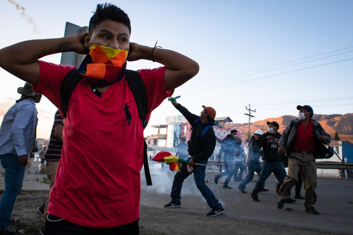 A man covers his mouth and noise to protect himself from the teargas during a protests that turned violent in Sacaba. Some 3,000 protesters from the rural regions demanded access to Cochabamba where t