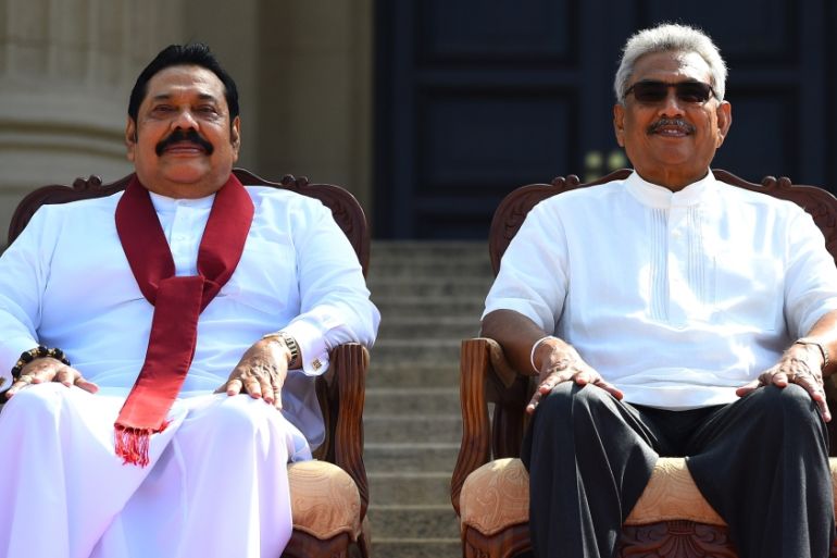 Sri Lanka''s new President Gotabaya Rajapaksa (R) and his Prime Minister brother Mahinda Rajapaksa, pose