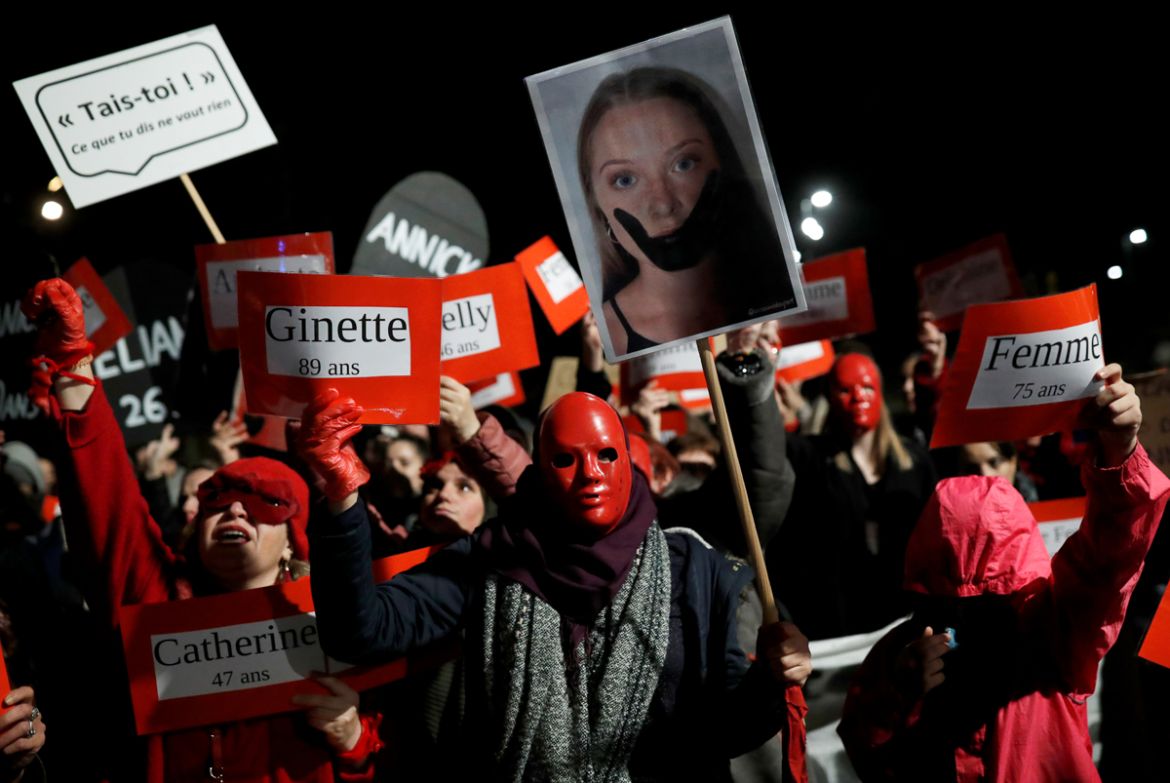 Women hold signs during a demonstration to protest femicides and violence against women, in Nantes, France November 25, 2019. REUTERS/Stephane Mahe