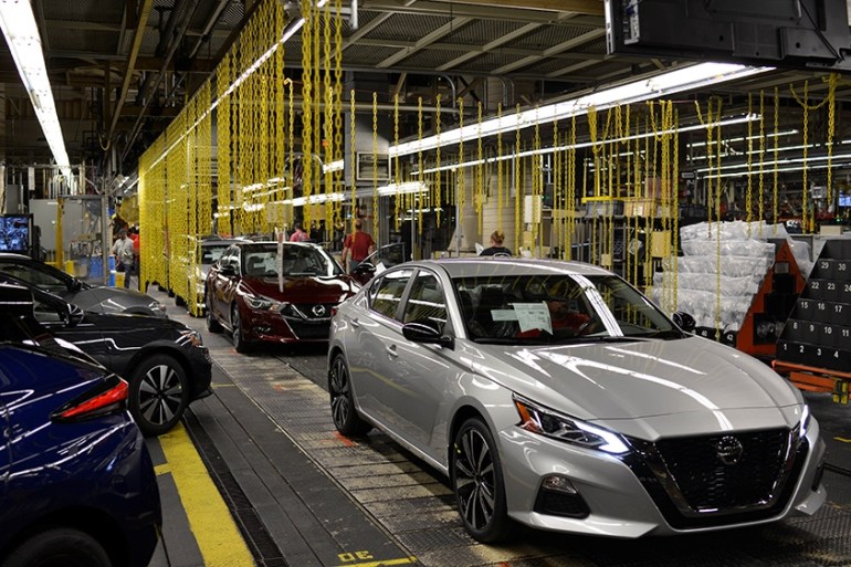 A finished Nissan Maxima followed by a Nissan Altima comes off the line at Nissan Motor Co's automobile manufacturing plant in Smyrna, Tennessee, US August 23, 2018