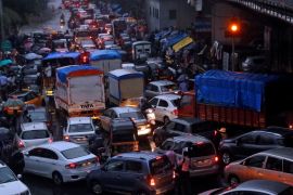 Vehicles are seen stuck in a traffic jam at an intersection after rains in Mumbai