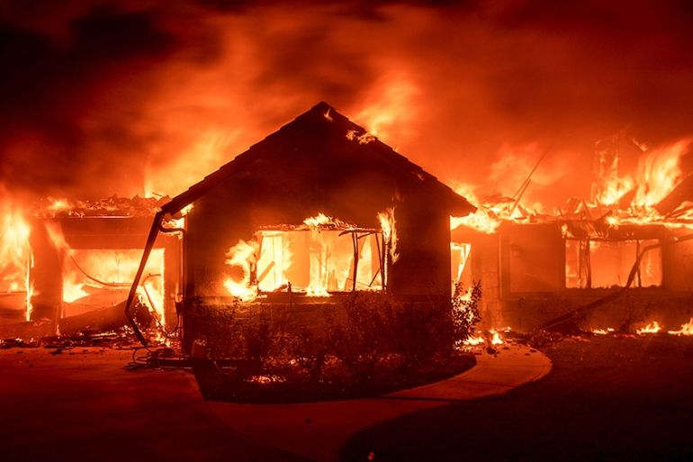 Flames from the Hillside Fire consume a home in San Bernardino, Calif., on Thursday, Oct. 31, 2019. The blaze, which ignited during red flag fire danger warnings, destroyed multiple residences. (AP Ph