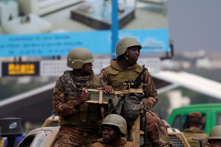 Malian soldiers patrol in Bamako stands guard in Bamako, Mali