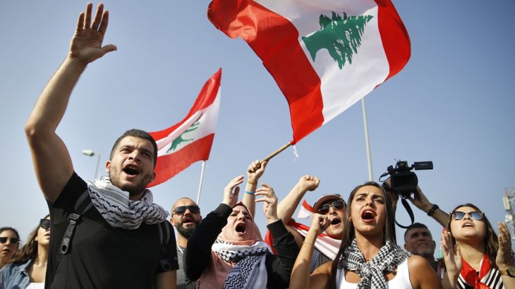 Anti-government protesters chant slogans against the Lebanese government