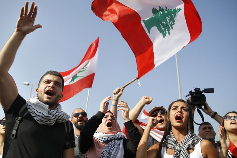 Anti-government protesters chant slogans against the Lebanese government