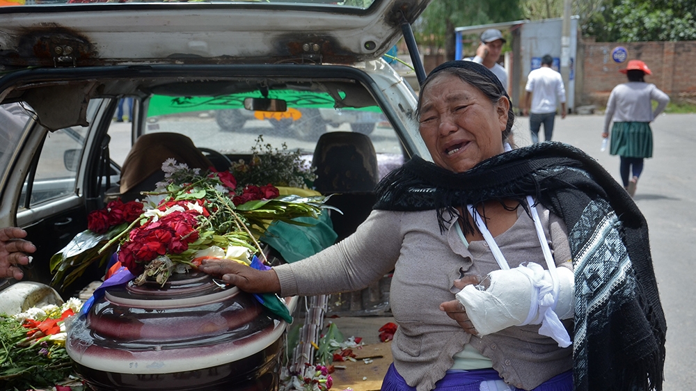 A relative mourns by the coffin of a supporter of Bolivian ex-President Evo Morales killed during clashes with the police in Sacaba, Cochabamba, Bolivia, on November 16, 2019. - The UN rights chief vo