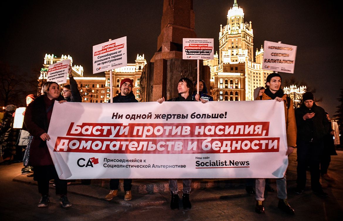 Demonstrators protest against violence towards women in Moscow on November 25, 2019. (Photo by Alexander NEMENOV / AFP)