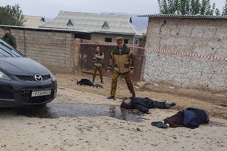 A handout picture taken and released on November 6, 2019 by the Ministry of Internal Affairs of the Republic of Tajikistan shows police investigators working at the site of an attack at the Ishkobod b