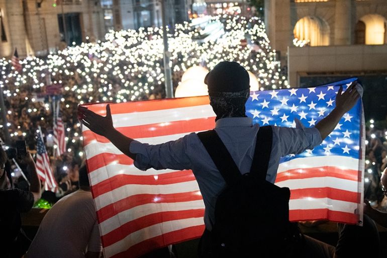 A protester are seen holding up an American Flag during a Rally in Hong Kong, China, October 14, 2019. Protesters gathered in the city''s central district in a police-sanctioned rally in support of th