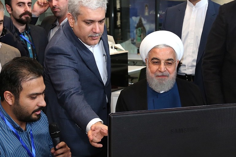 A handout photo made available by the Iranian Presidential Office shows Iranian President Hassan Rouhani (C) visiting a Noavari factory in Tehran, Iran, 05 November 2019. According to media reports, R