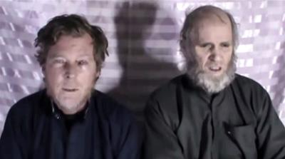 Timothy Weeks and Kevin King speak to the camera while kept hostage by Taliban insurgents in an unknown location, said to be Afghanistan, in this still image taken from a social media video said to be