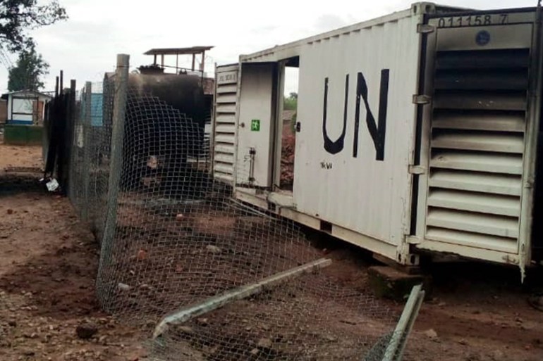 Burnt containers are seen at the United Nations (UN) civil base in Beni in the eastern part of the Democratic Republic of Congo on November 26, 2019. - On November 25, 2019 angry demonstrators ransack