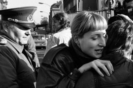East and West Berlin women embracing, 1999