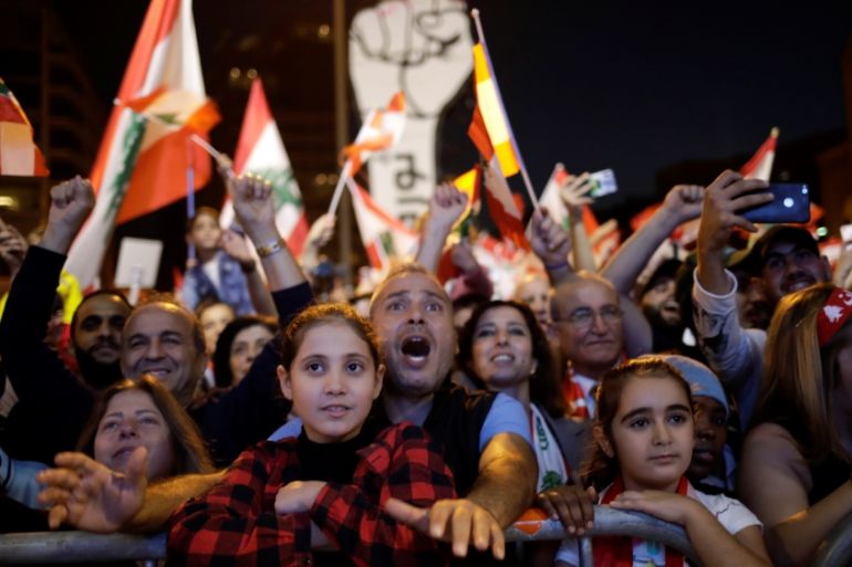 Protesters react at a demonstration during ongoing anti-government protests in Beirut