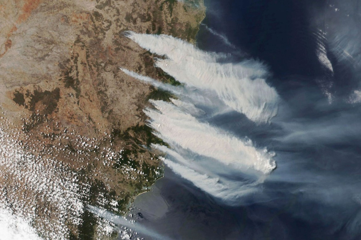 satellite photo taken by NASA shows hot, dry and windy weather conditions as bushfires burn in the eastern part of News South Wales state. Hundreds of schools were closed and residents were urged to e