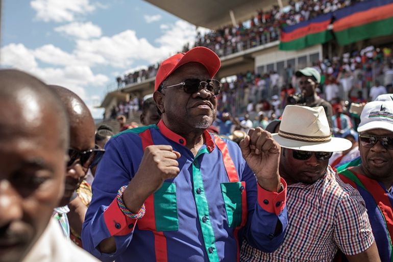 Namibian current President and Namibian ruling party South West Africa People''s Organisation (SWAPO) Presidential candidate Hage Gottfried Geingob (C) arrives to address the final Namibian General ele