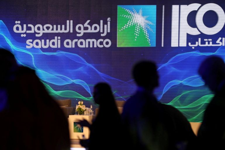 Sign of Saudi Aramco''s IPO is seen during a news conference by the state oil company in Dhahran
