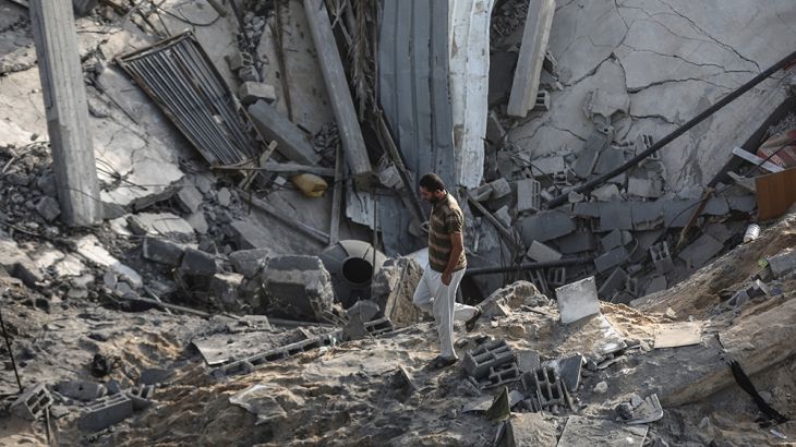 KHAN YUNIS, GAZA - NOVEMBER 13: A Palestinian man inspects debris after Israeli airstrikes hit their homes in Khan Yunis, Gaza as tension rises between Israel and Gaza after commander in the Al-Quds B