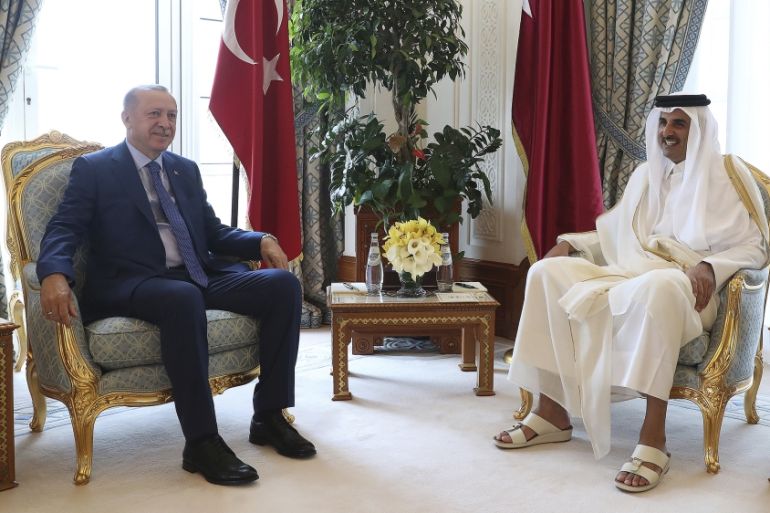 Qatar''s Emir Sheikh Tamim bin Hamad Al Thani, right, and Turkey''s President Recep Tayyip Erdogan pose for photos for the media before their meeting in Doha, Qatar, Monday, Nov. 25, 2019. Erdogan is in