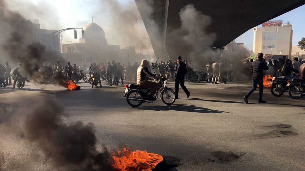 This is to amend image epa08002047 issued on 16 November 2019, correcting CITY to Isfahan (not: Tehran). The revised caption reads:   Iranian protesters block a highway following fuel price increase i