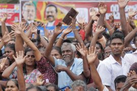 Supporters of Sri Lankan presidential candidate and former defense chief Gotabaya Rajapaksa cheer during a rally in Neluwa village in Galle, Sri Lanka, Tuesday, Oct. 22, 2019. Rajapaksa is the front-r