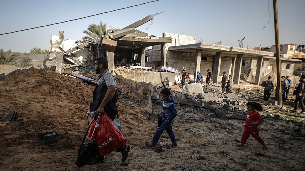 RAFAH, GAZA - NOVEMBER 13: People inspect debris after Israeli airstrikes hit Abu Hadayids' home in Rafah, Gaza as tension rises between Israel and Gaza after commander in the Al-Quds Brigades, the ar