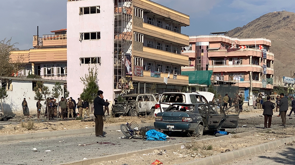 Afghan security personnel gather at the site of an explosion in Kabul, Afghanistan, Wednesday, Nov. 13, 2019. An explosion has rocked the Afghan capital of Kabul as early morning commuters were on the