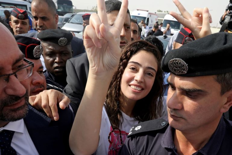 Jordanian citizen Hiba Labadi gestures upon her release by Israel, at the King Hussein Bridge crossing near Amman