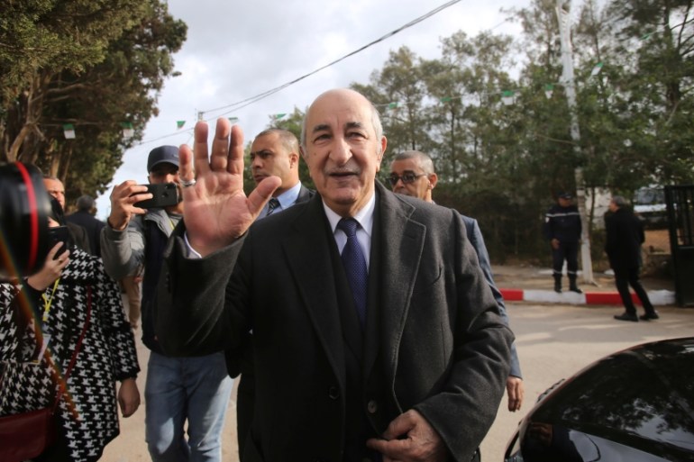 Algeria''s presidential candidate Abdelmadjid Tebboune greets attendees during the presidential election in Algiers
