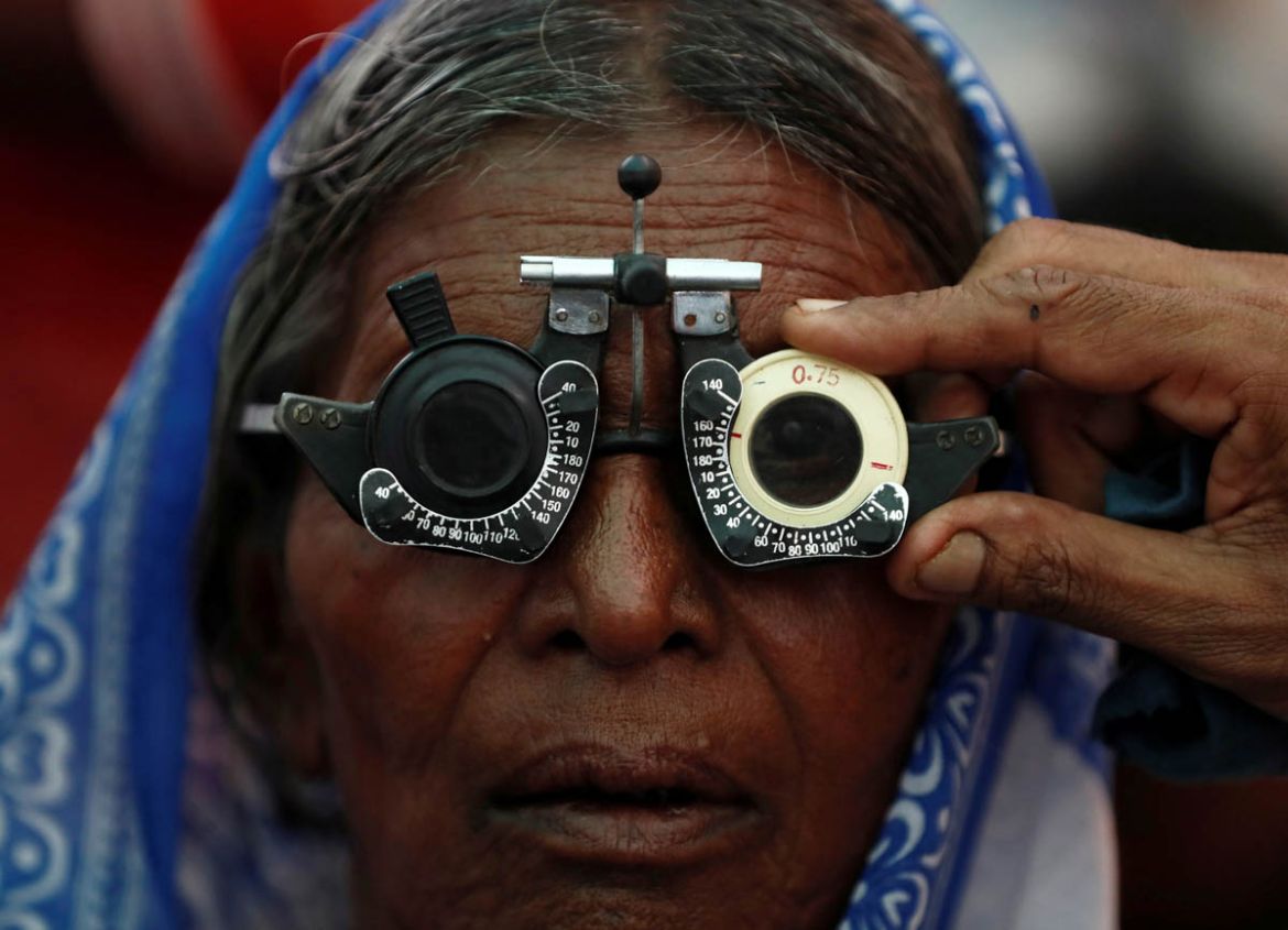 A woman gets her eyes tested at a free eye-care camp on the occasion of Indian politician Babasaheb Ambedkar''s death anniversary in Mumbai, India, December 6, 2019. REUTERS/Francis Mascarenhas TPX IMA