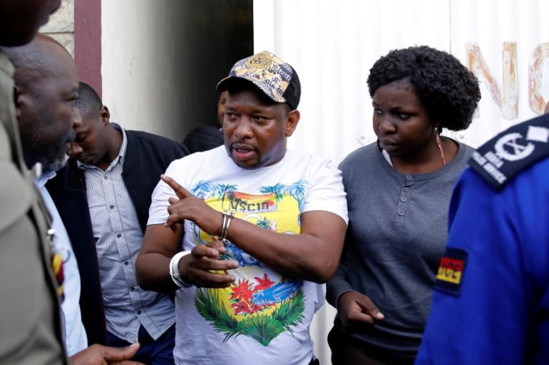 Nairobi''s Governor Mike Sonko is escorted by police officers after his arrest, at the Wilson airport in Nairobi